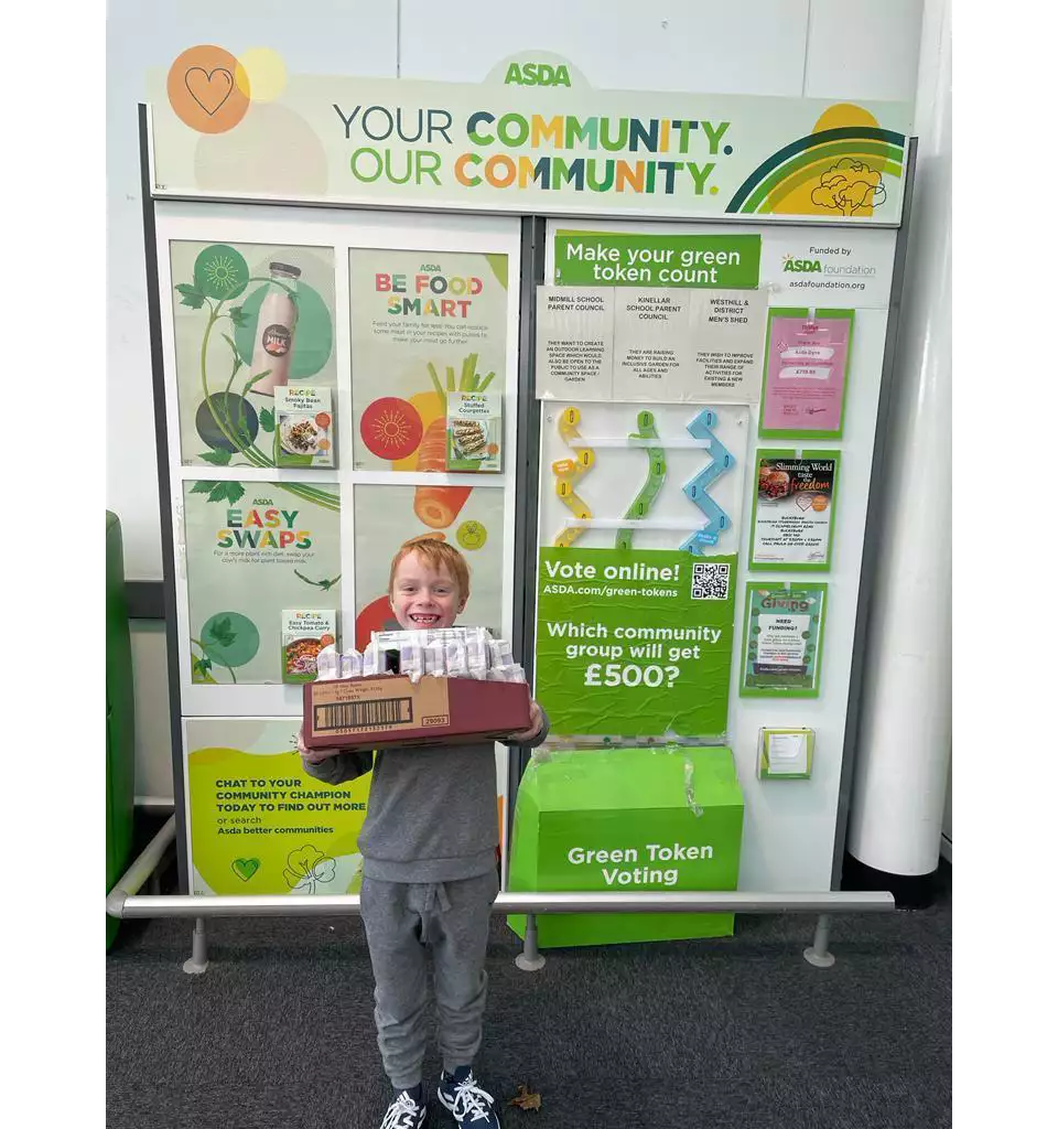 Harry from Heathryburn School PTA was happy to accept our donation of boxes of raisins they are using as part of a fundraiser. | Asda Dyce