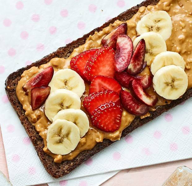Peanut butter with strawberry, cherry and banana smash toast