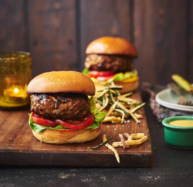 American-style burgers with cheese sauce and courgette fries