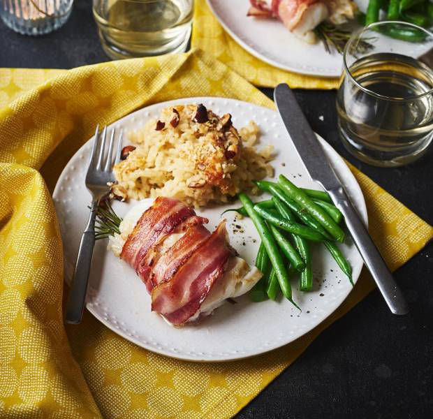Bacon-wrapped cod with baked Parmesan risotto