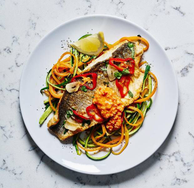 Pan-fried sea bass with romesco sauce and vegetable noodles