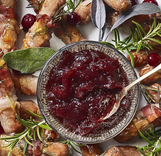 Wreath of rosemary pigs in blankets with cranberry sauce