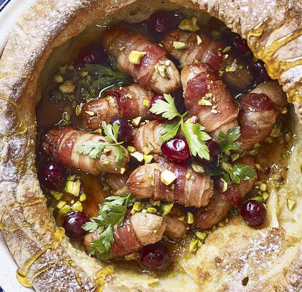 Giant Dutch baby pancake with candied pigs in blankets