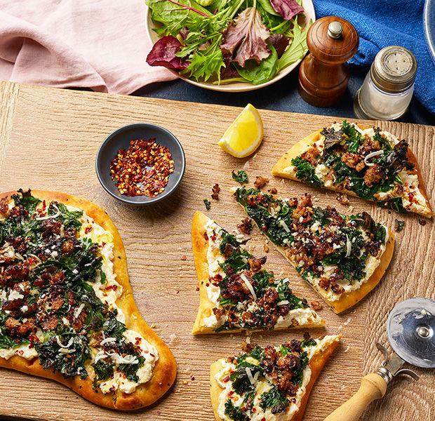 Cheat's spicy sausage, kale and ricotta pizza