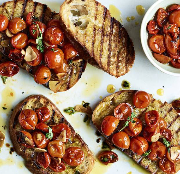 Vegan confit tomatoes with thyme and garlic on sourdough toast