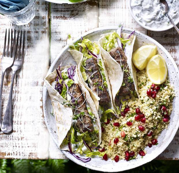 Lamb kebab tacos with jewelled cous cous and courgette tzatziki