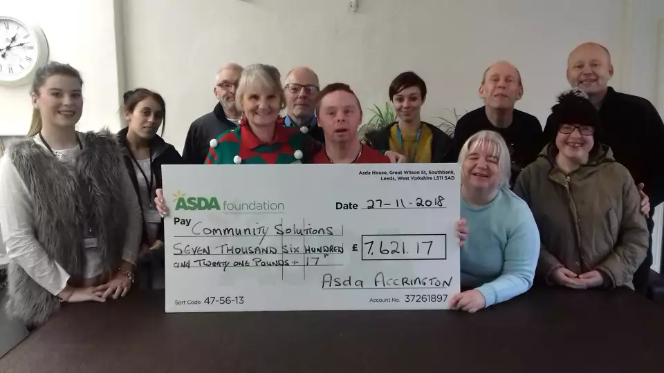 Asda Accrington presented a cheque for £7,000 to Community Solutions North West