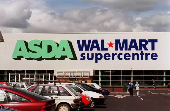 Old Asda store features a white building and green and blue logos