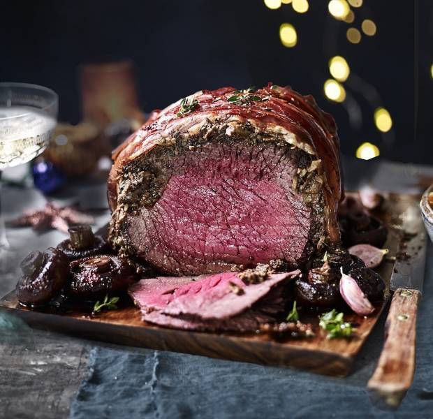 Prosciutto-wrapped roast beef with sage and porcini mushrooms