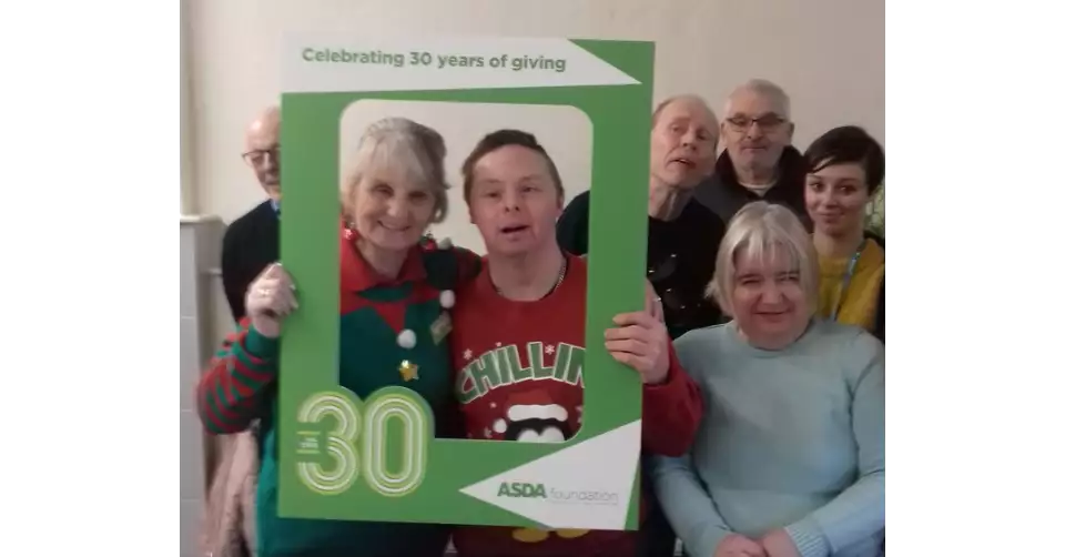 Asda Accrington present an Asda Foundation grant for £7,000 to Community Solutions North West